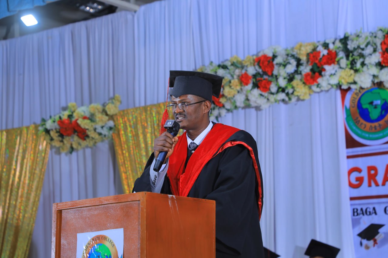 The Dean of Golden State College speaking at graduation