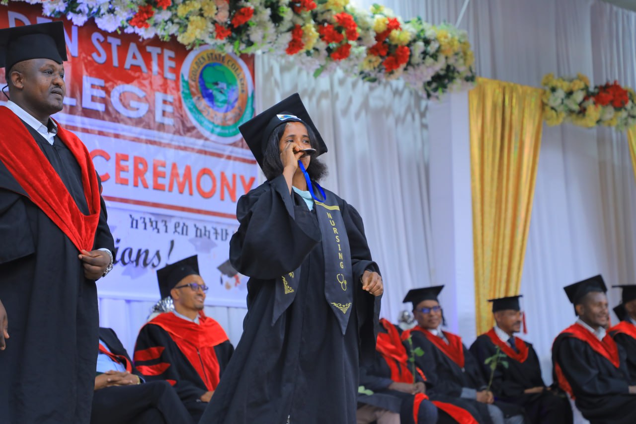 A graduating student sharing her voice at the ceremony